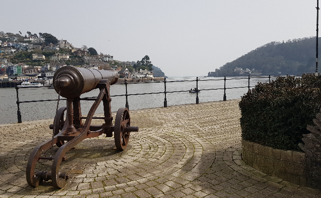 An image with a cannon pointing out to sea.